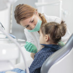 Little girl at the dentist checkup